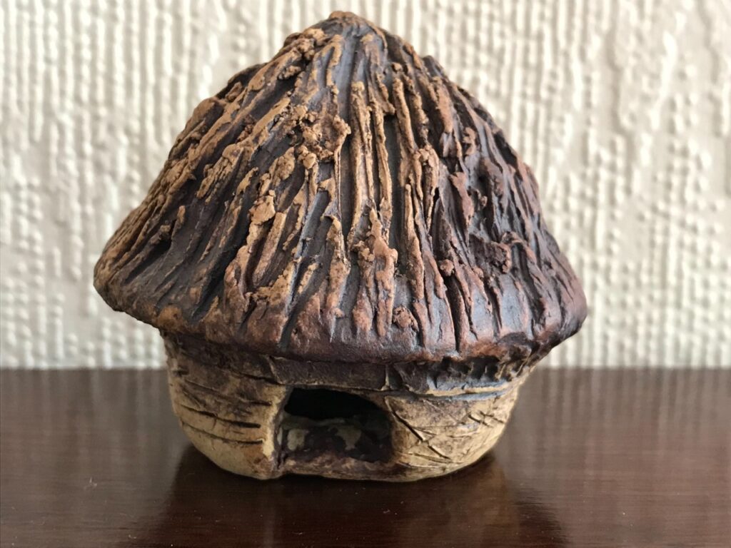 Photo of miniature clay crannog made by Sioned, a visitor at the centre.